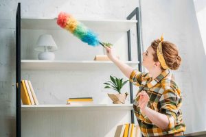 Dusting off furniture clean brush